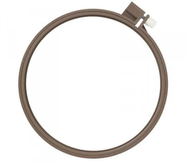 A brown, circular embroidery hoop with a white connector at the top.