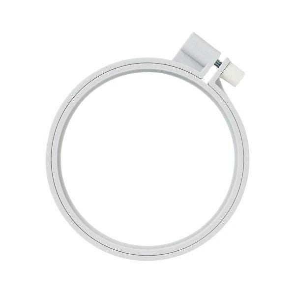 A white, circular embroidery hoop with a small white attachment on the top.