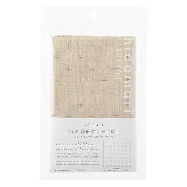 a package of fabric with a beige pattern and text in Japanese.