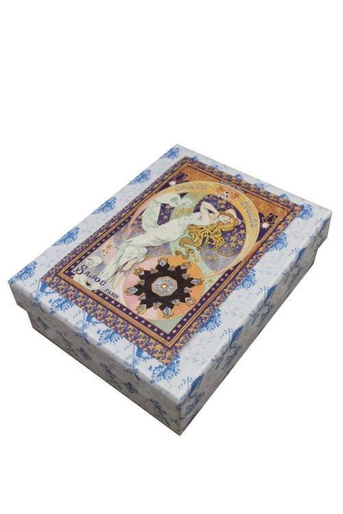 a decorative box with a floral pattern and an illustration of a woman on the lid.