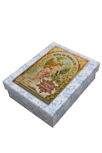 a decorative box with a floral pattern and an illustration of a woman on the lid.