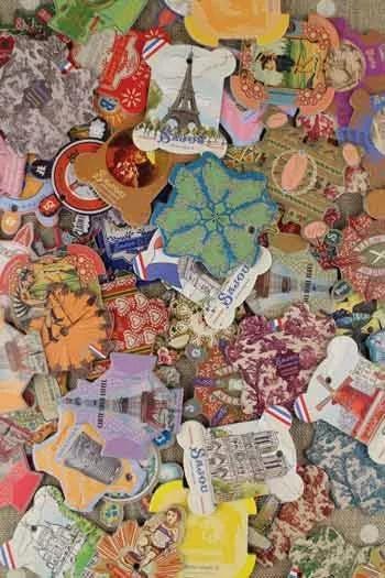 The image is a collage of various colorful and patterned items, including buttons, stickers, and other decorative elements, arranged in a visually interesting manner.