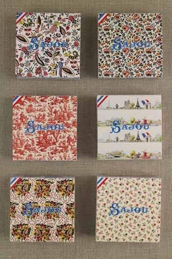 six different boxes with various patterns and designs, including floral, geometric, and abstract patterns. The boxes appear to be related to a brand or product, as they have the word "Saujour" written on them.