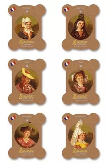 six identical brown spool-shaped frames, each containing a portrait of a woman. The frames have a vintage or antique appearance, suggesting they may be related to a historical or artistic theme.