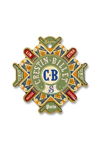 a decorative emblem with a central circular design surrounded by various text elements.