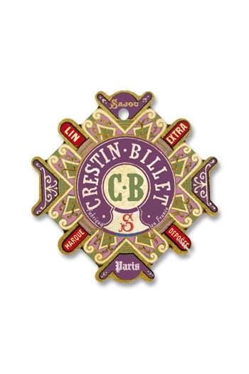 a decorative emblem with a central circular design surrounded by various text elements.