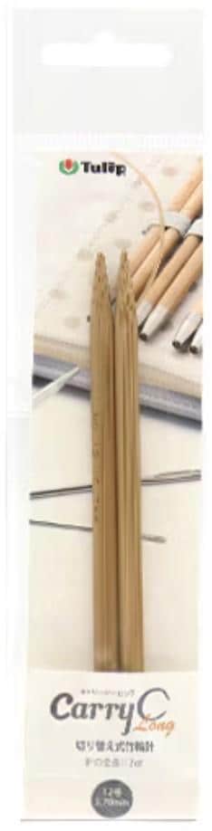 A pair of wooden knitting needles in a package, with a label that includes the brand name and product information.