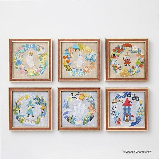 a collection of six framed cross-stitch artworks, each featuring a unique design and color scheme. The artworks are arranged in a grid pattern on a white wall, showcasing the creativity and skill of the artists.