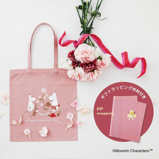 a pink tote bag with a floral design, a bouquet of pink and white flowers, and a pink gift bag with a floral design.