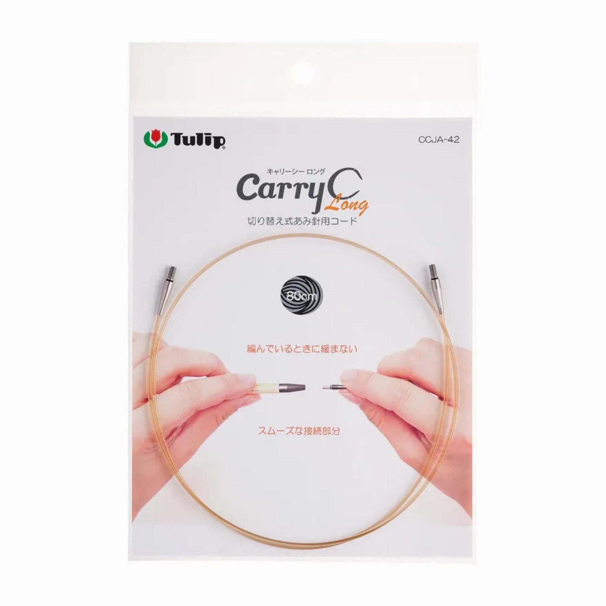 a package for a knitting needle, specifically a "Carry Long" knitting needle. The package features a close-up of a hand holding the needle, along with the product name and a circular logo.