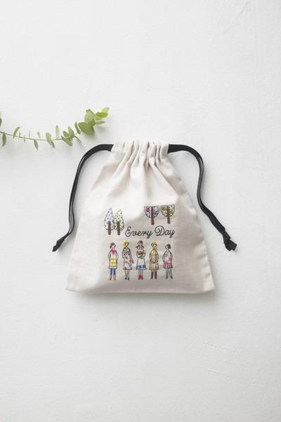 A white drawstring bag with a printed design of people and trees, along with the text "Every Day" printed on it.