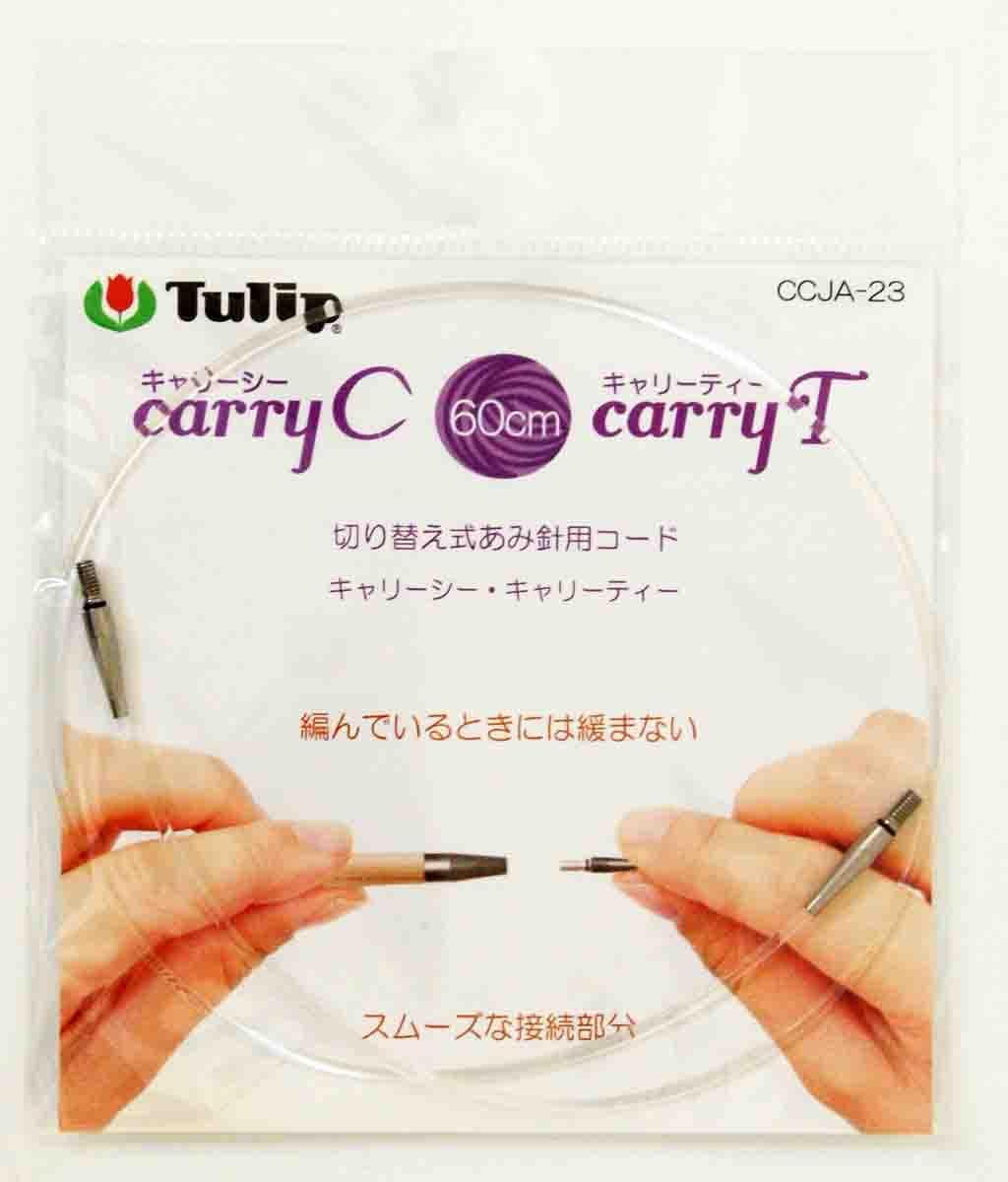 a pair of hands holding a clear plastic bag containing a clear plastic bag with a purple and white design.