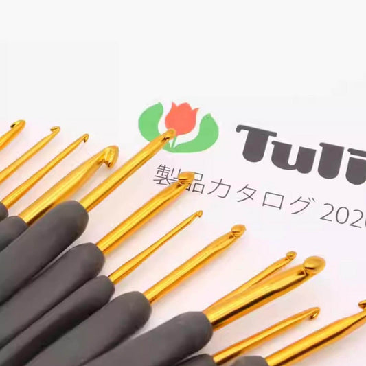 A collection of crochet hooks in various sizes and colors, arranged on a white background with a logo and text.