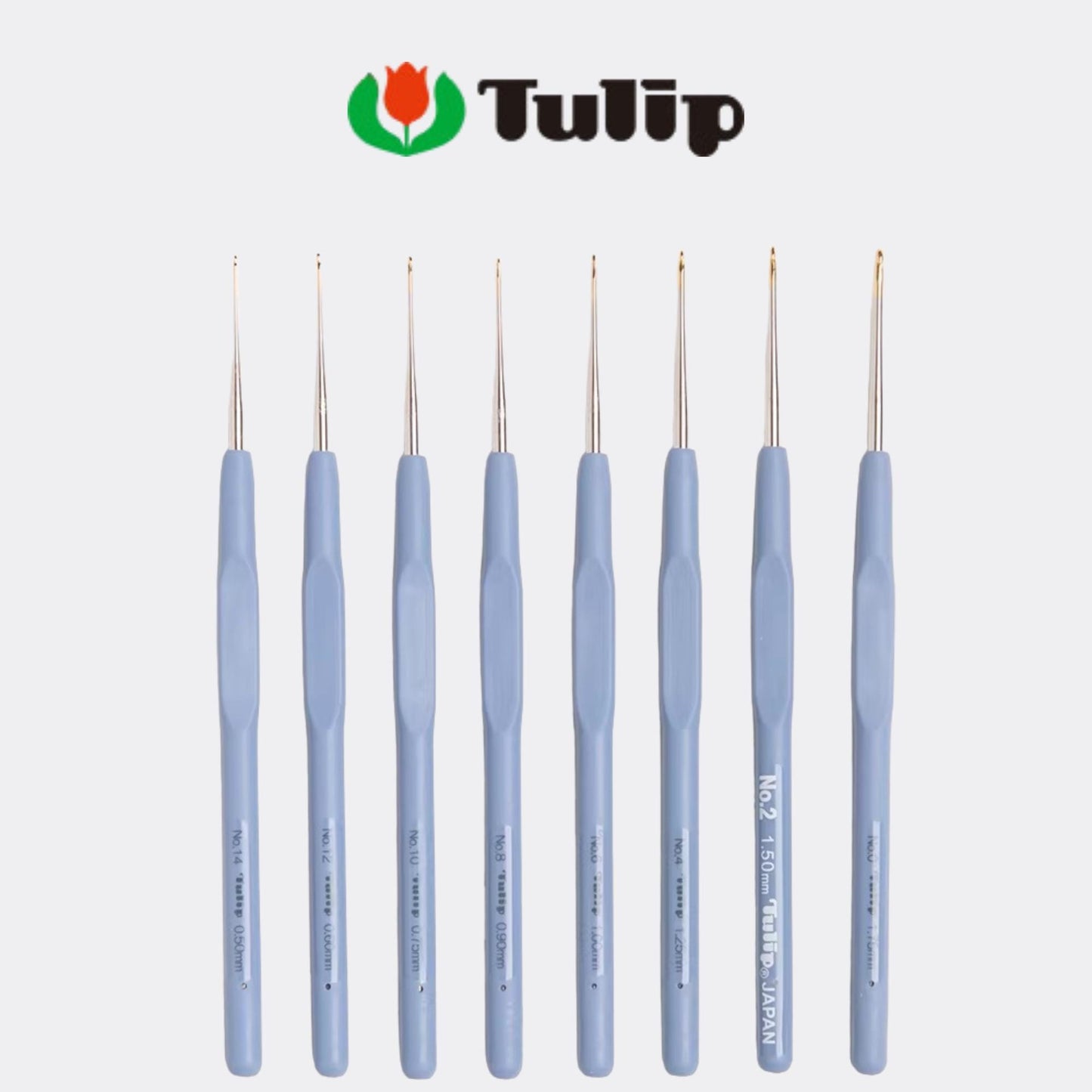 A collection of nine crochet hooks in various sizes and colors, arranged in a row against a white background.