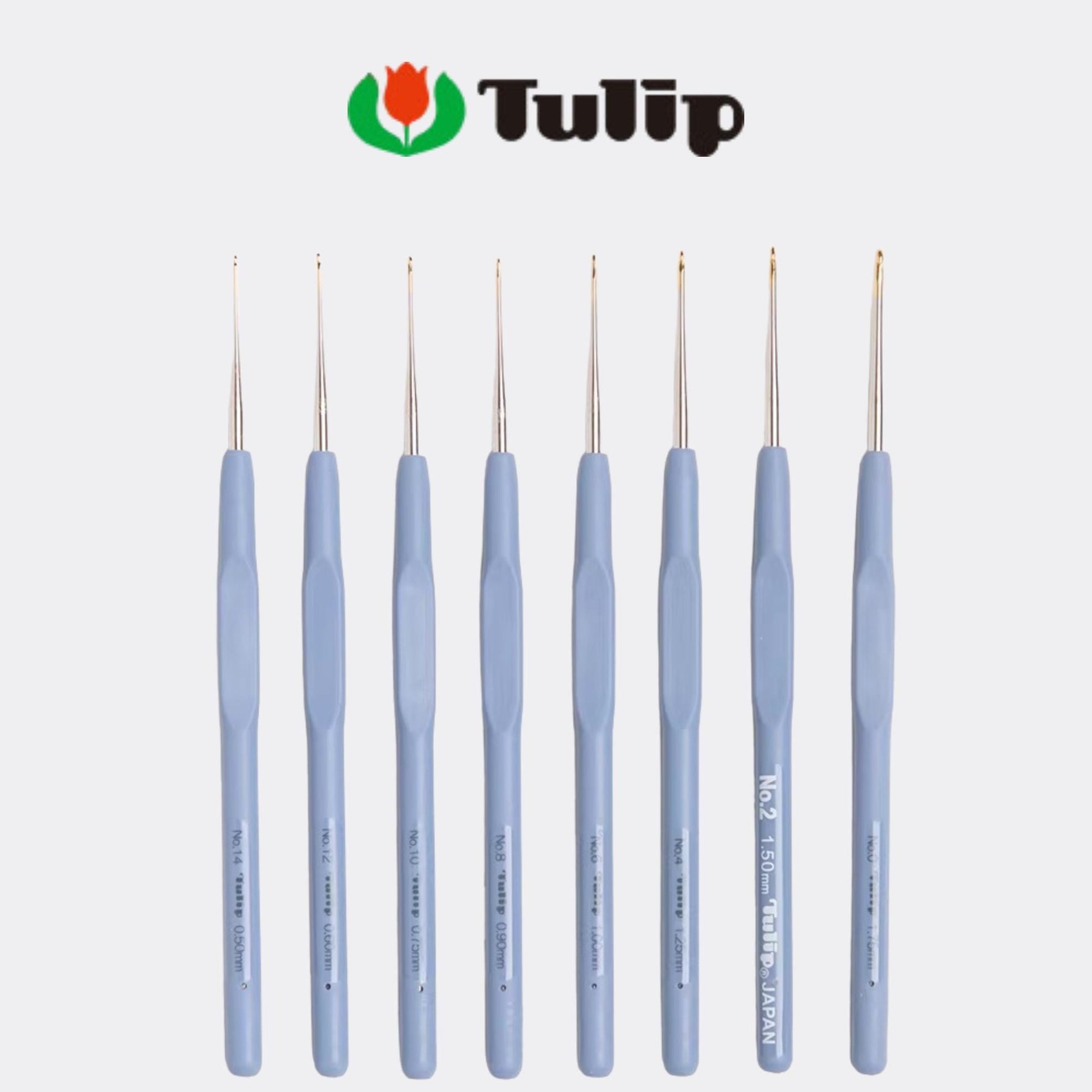 A collection of nine crochet hooks in various sizes and colors, arranged in a row against a white background.