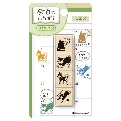 The image is a stamp with various animal illustrations, including dogs, cats, and birds. The stamp appears to be a creative and decorative item, possibly used for personal or artistic purposes.