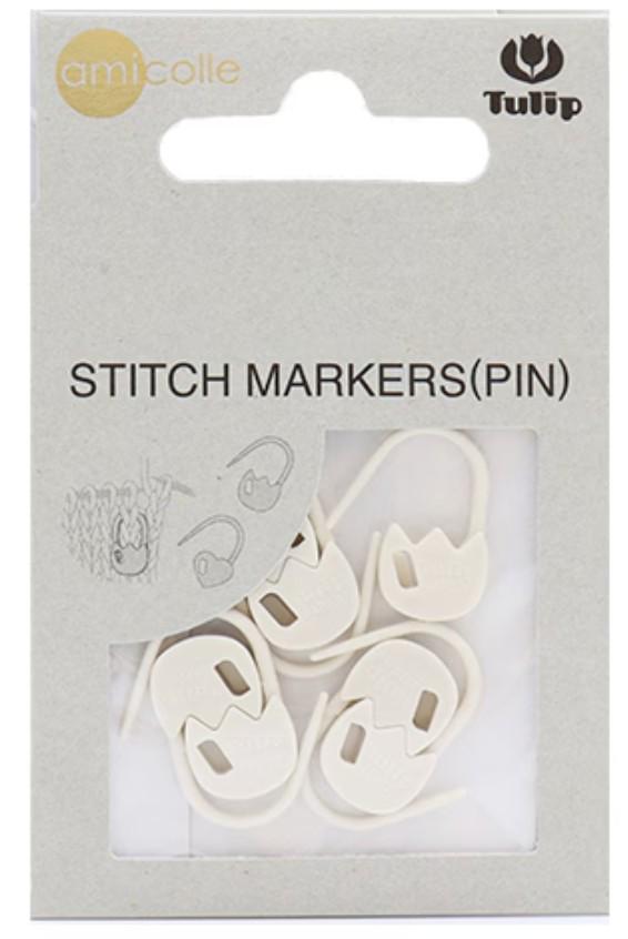 a package of white sewing markers, also known as pins, with a clear plastic window allowing a view of the markers inside.