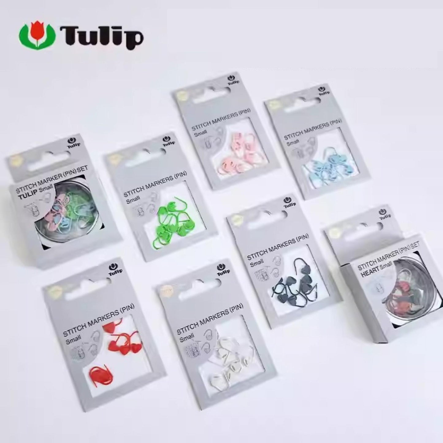 A collection of various Stitch markers (PIN) in different sizes and colors, including small, medium, and large markers, as well as heart-shaped markers.