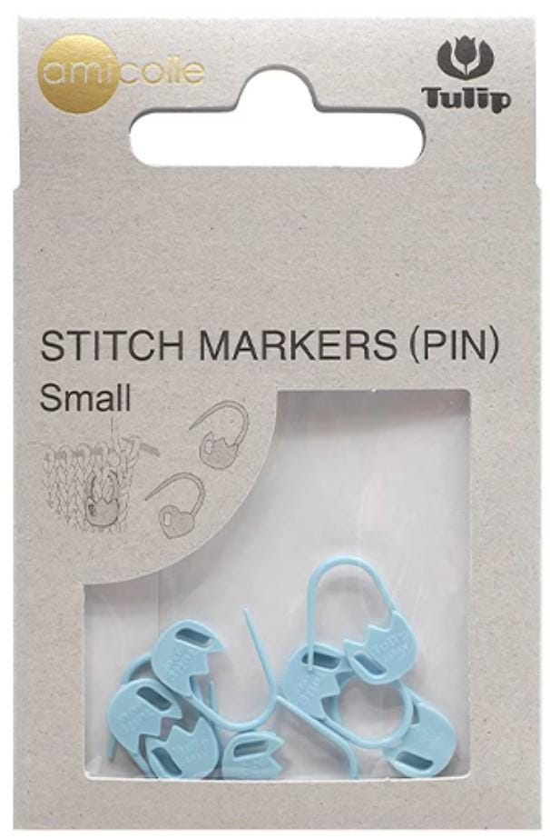 A package of small blue sewing markers, labeled as pins, with illustrations of the markers on the packaging.