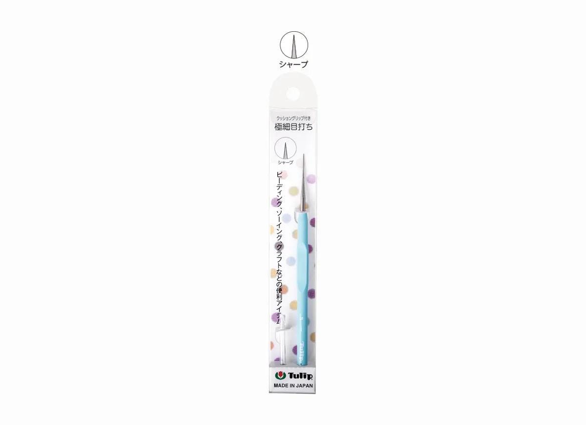 A white and blue pencil with a dotted pattern, packaged in a Japanese-language cardboard box.