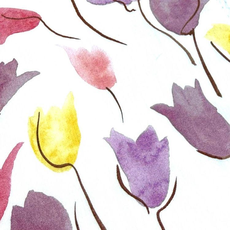 a close-up view of various watercolor flowers in different colors, including red, yellow, and purple.