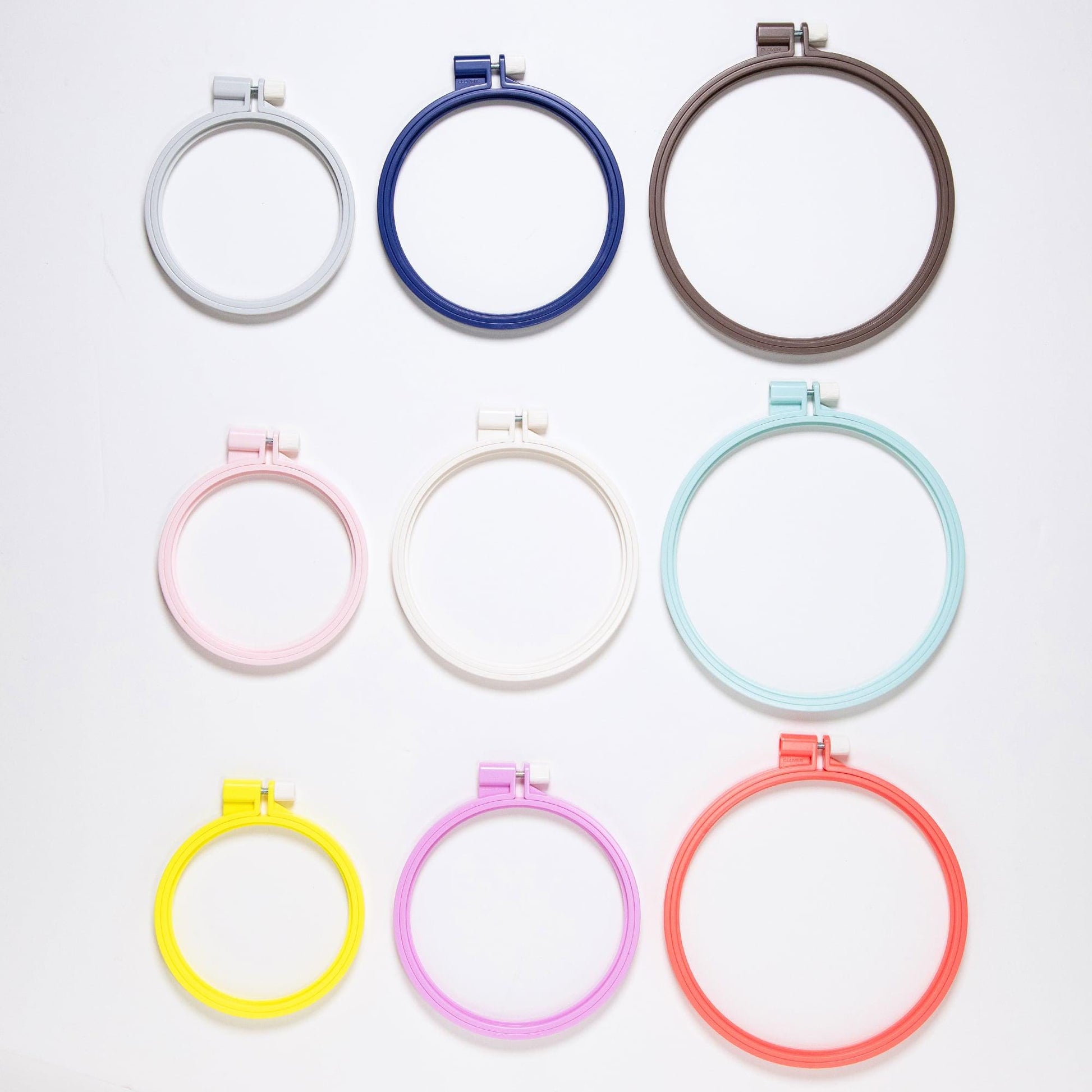 a collection of nine embroidery hoop sizes arranged in a grid pattern.