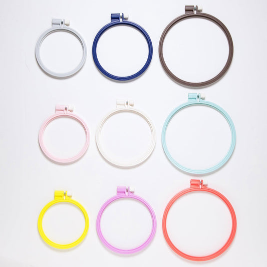 a collection of nine embroidery hoop sizes arranged in a grid pattern.