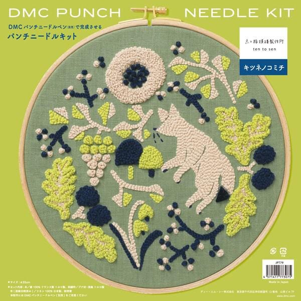 The image is a detailed embroidery design featuring a fox surrounded by various flowers and leaves in shades of green and blue. The design is set against a green background with a brown border.