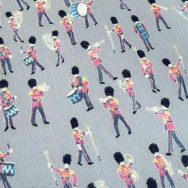 a repeating pattern of various musical instruments, including drums, cymbals, and brass instruments, all depicted in a stylized manner.