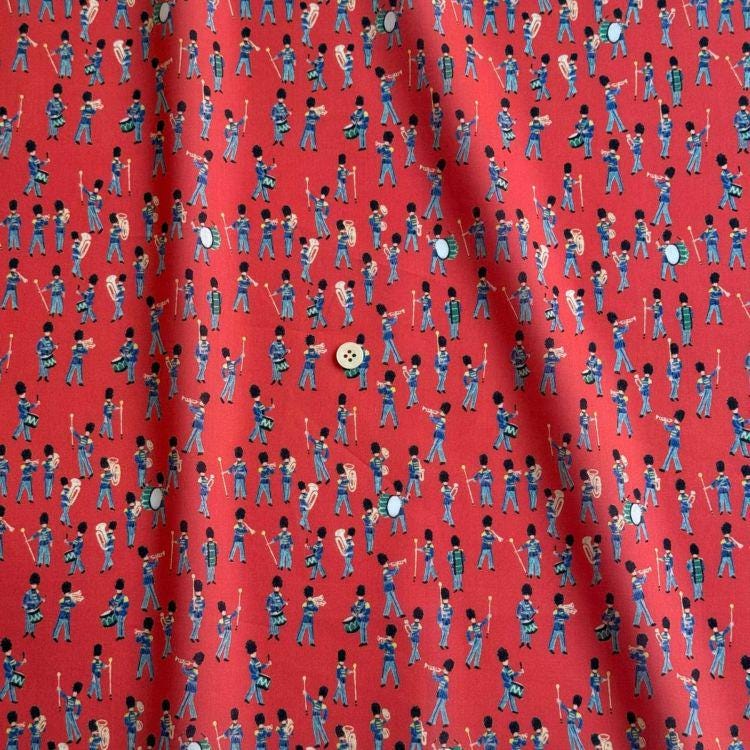 a repeating pattern of soldiers marching in formation, with a small white circle in the center.