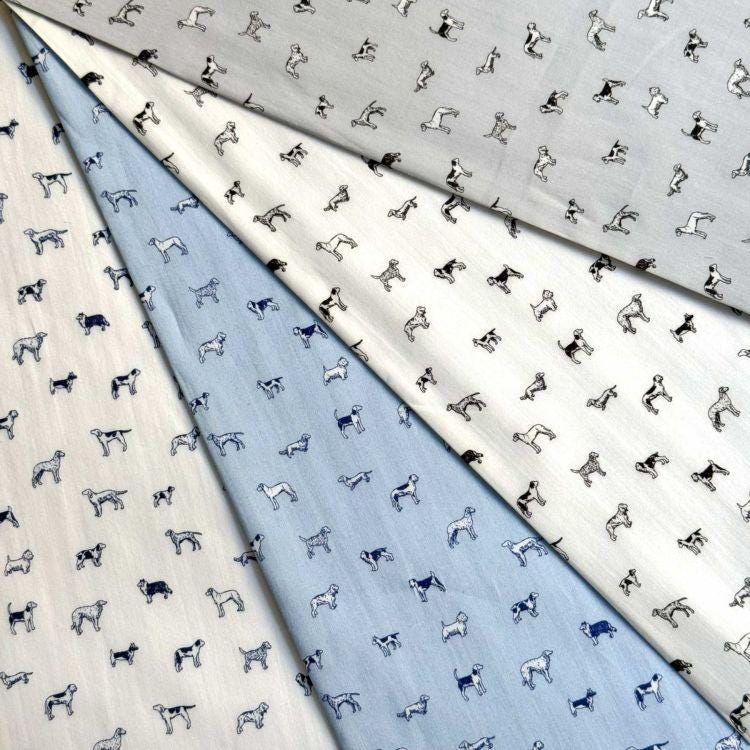 The image is a collage of fabric swatches with a repeating pattern of dogs in various shades of gray and white.