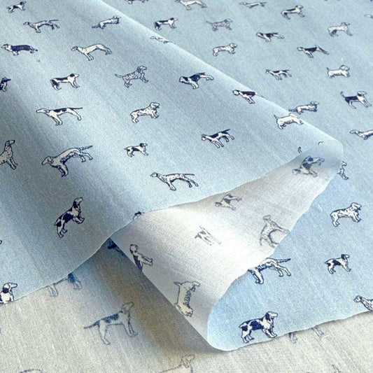 a fabric with a repeating pattern of dogs printed on it.
