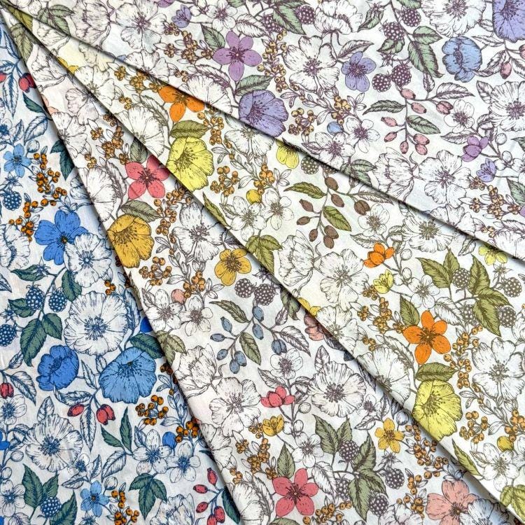The image is a collage of various fabric swatches with different floral patterns, including white, blue, yellow, and orange flowers.