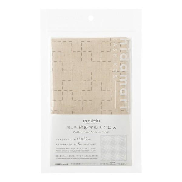 a package of fabric with a beige pattern and text in Japanese.