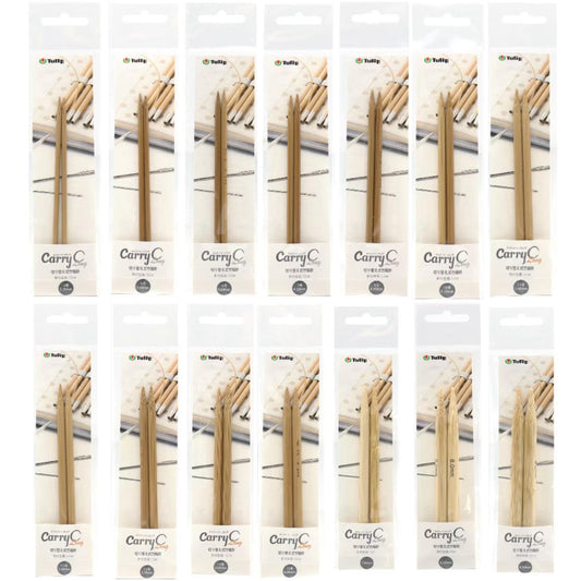 a collection of wooden knitting needles in various sizes and colors, packaged in individual boxes.