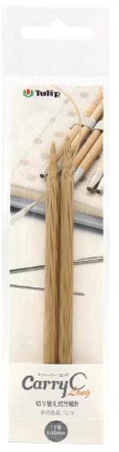 A package containing two wooden knitting needles, with a picture of the needles and some other knitting-related items on the background.
