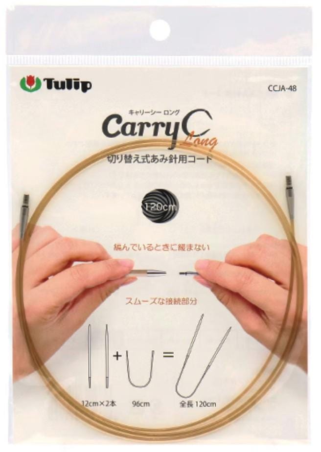 a package of knitting needles with a person's hands holding the ends of the yarn.