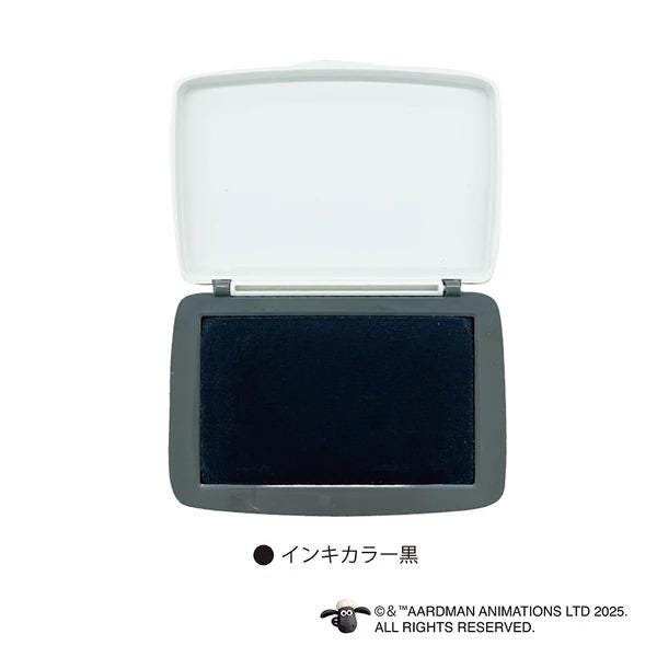 a black and white stamp with a white lid, placed on a white background.