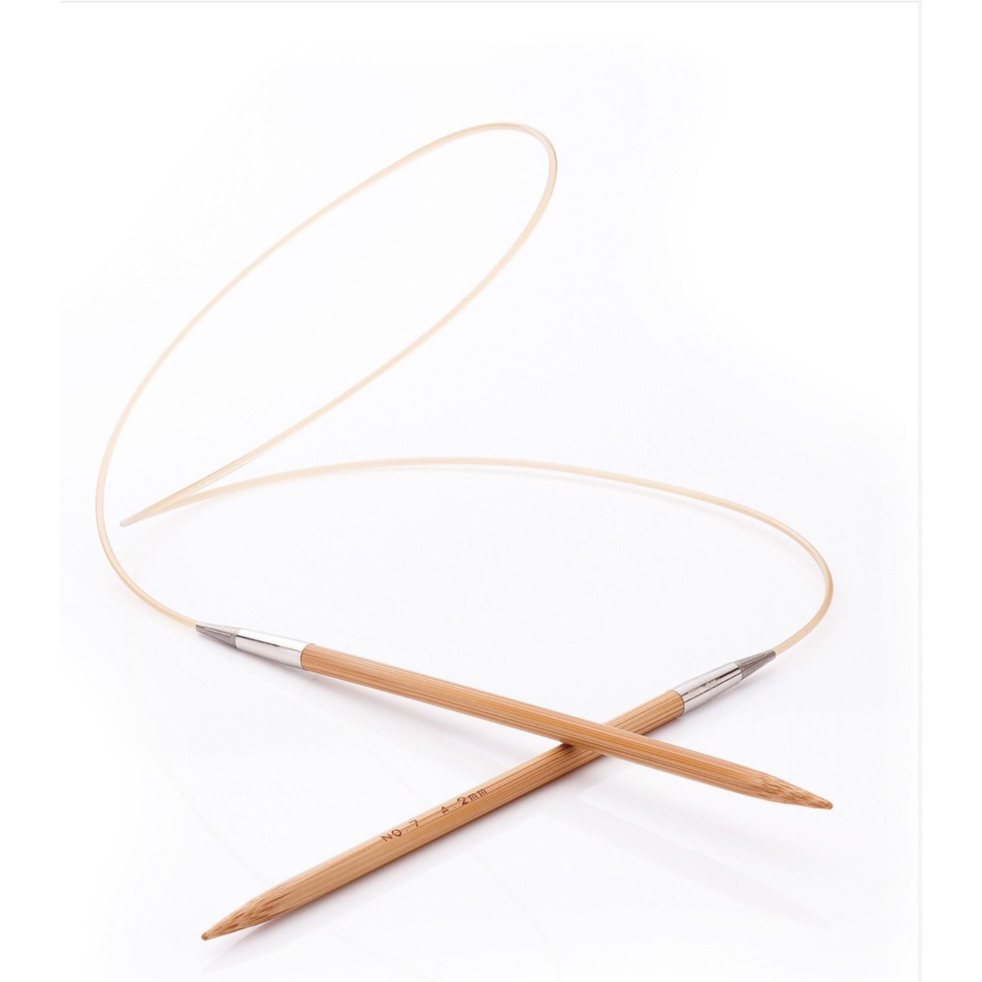 two wooden knitting needles crossed over each other.