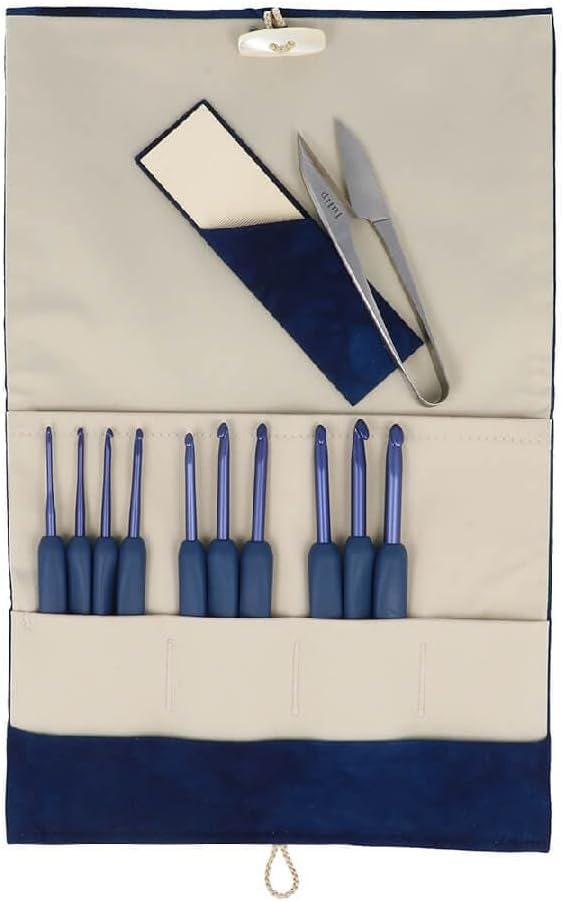 A crochet set with a beige and blue color scheme, containing a pair of scissors and a set of crochet hooks.