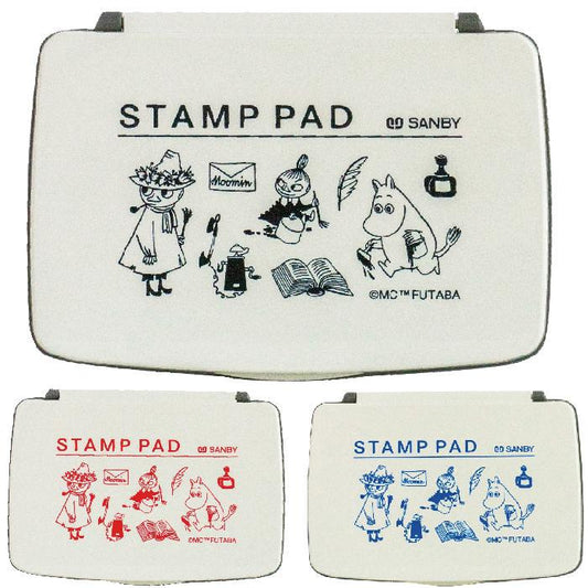 three white stamp pads with various cartoon illustrations and text. The text on the stamp pads includes "STAMP PAD" and "SANBY" along with other characters and objects such as a book, a bird, and a clock.