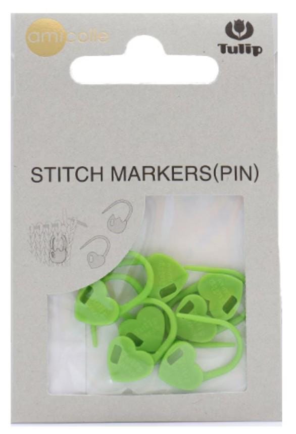 A package of green sewing markers (pin) with a clear plastic window, allowing the markers to be seen inside.