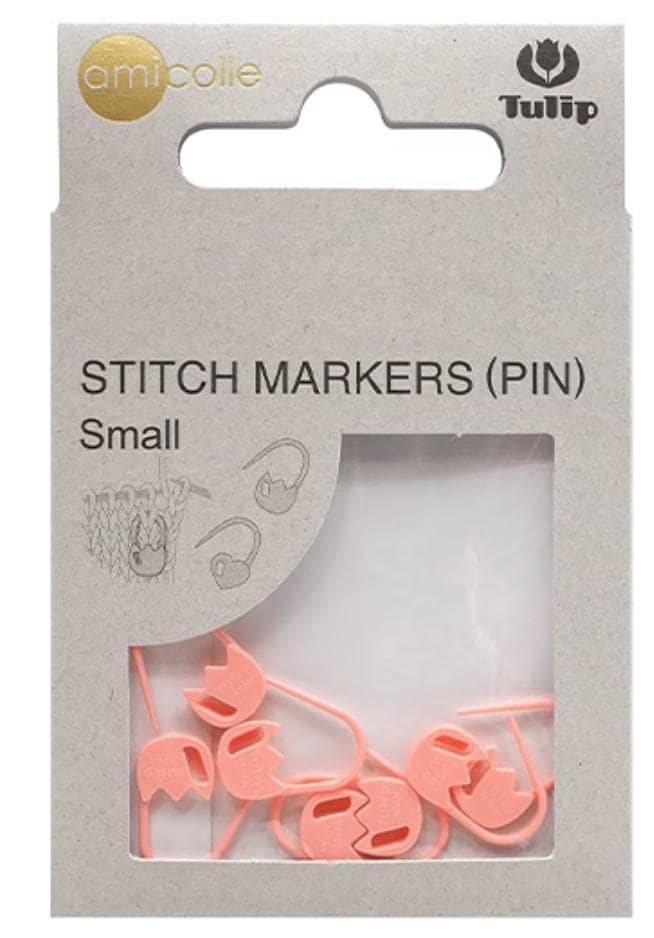 a package of small pink sewing markers, also known as pins, with a clear plastic window allowing a view of the markers inside.
