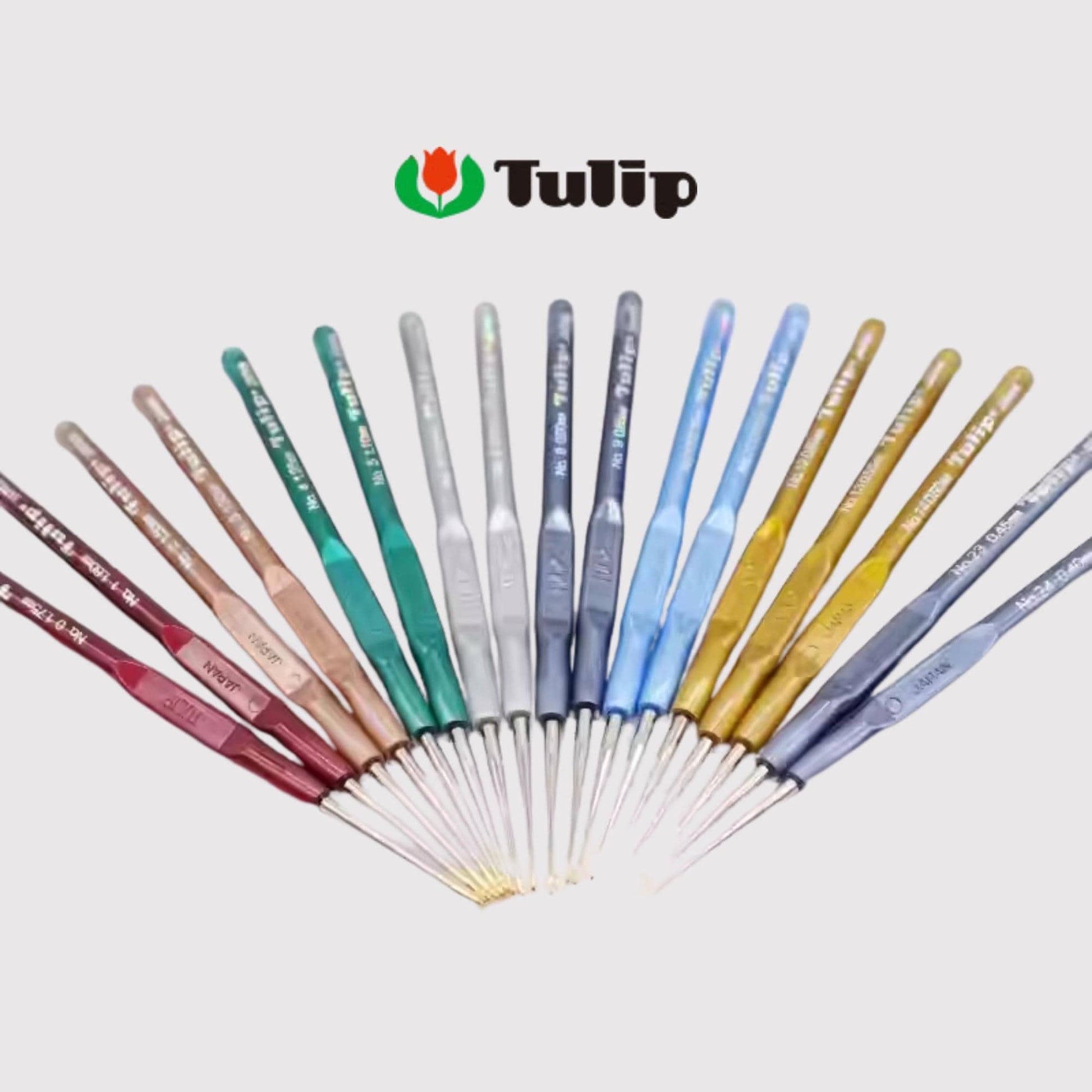 A collection of colorful crochet hooks arranged in a fan-like pattern, with the brand name "Tulip" displayed above them.