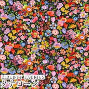 The image is a collage of various colorful flowers and plants, creating a vibrant and lively pattern.