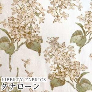 a repeating floral pattern with white flowers and green leaves on a white background.