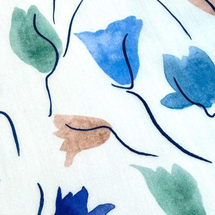 abstract floral designs in various colors, including blue, green, and brown, arranged in a visually appealing manner.