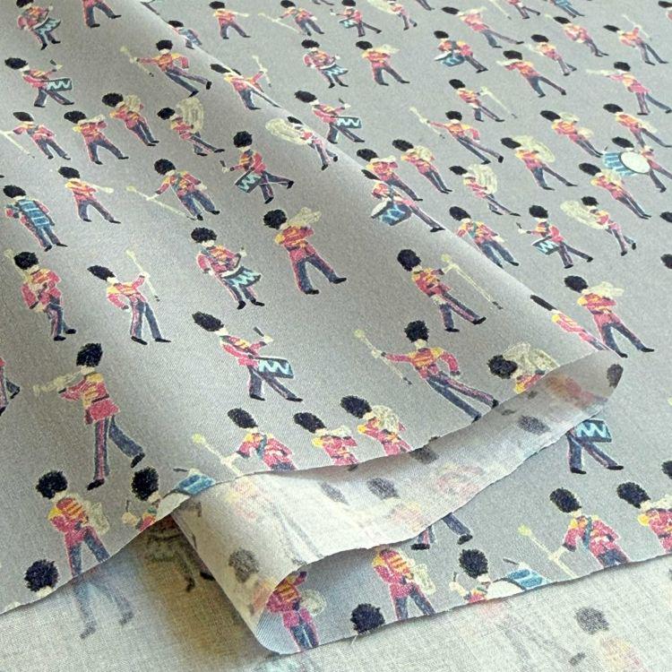 a repeating pattern of soldiers marching in formation, with each soldier wearing a distinctive uniform.