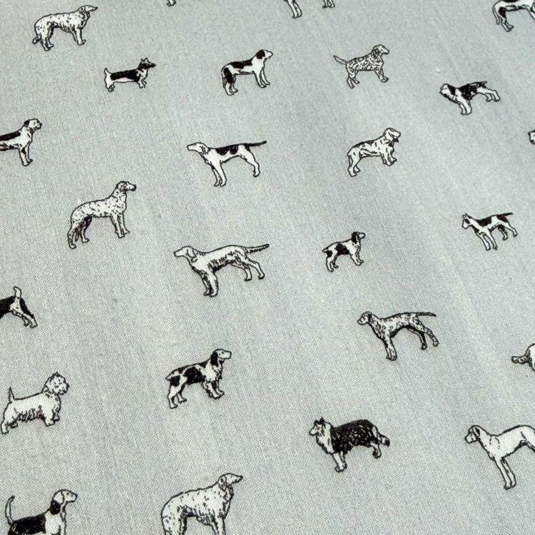 a repeating pattern of various dog breeds, including Beagles, Labradors, and others, all depicted in black and white.