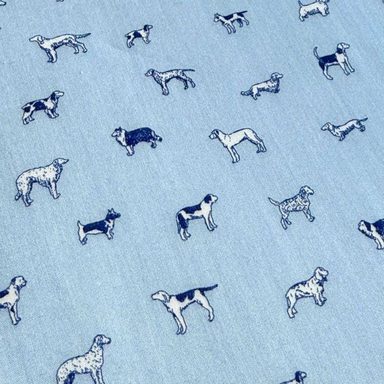 a repeating pattern of various dog breeds, including Beagles, Doberman Pinscher, and others, all depicted in a stylized manner.
